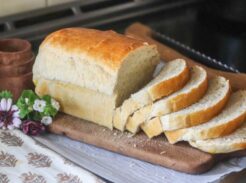Loaf of sliced sandwich bread on a cutting board