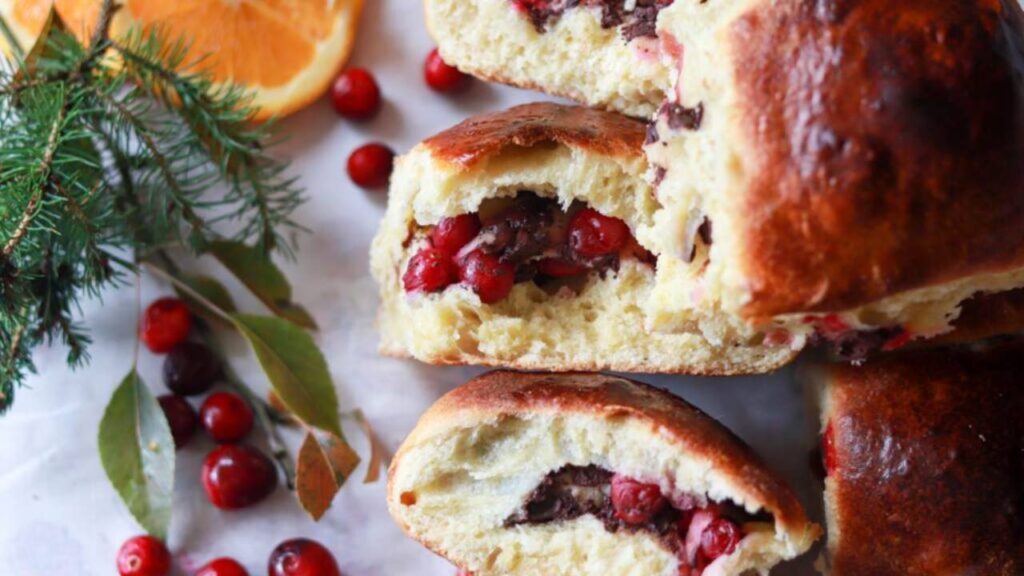 Chocolate chip cranberry sourdough brioche rolls close up in pan