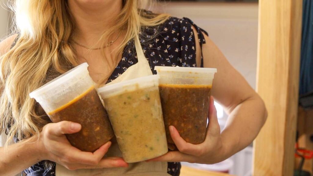 woman holding frozen soups