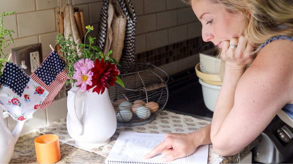 woman reading a cookbook
