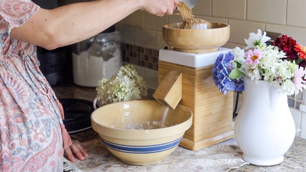 Grinding wheat berries into fresh flour at home