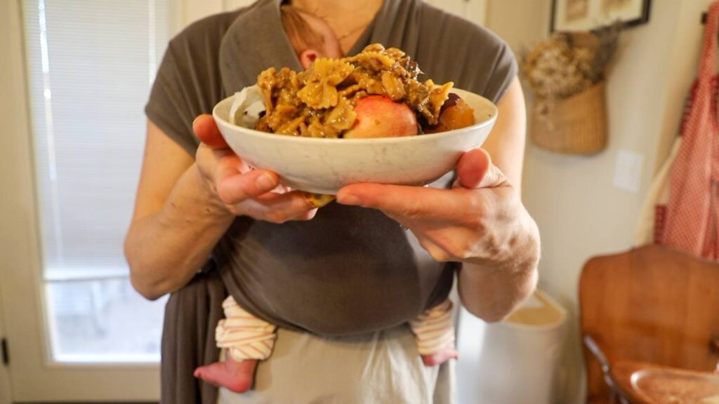Person holding a bowl of food scraps before adding them to the Mill
