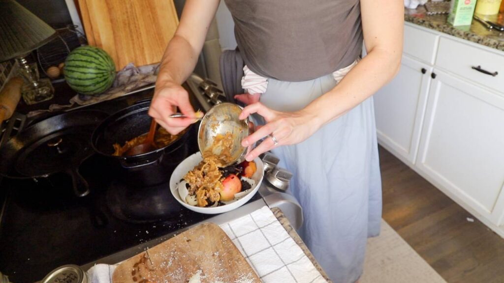 Food scraps being added to the Mill food recycler from a bowl