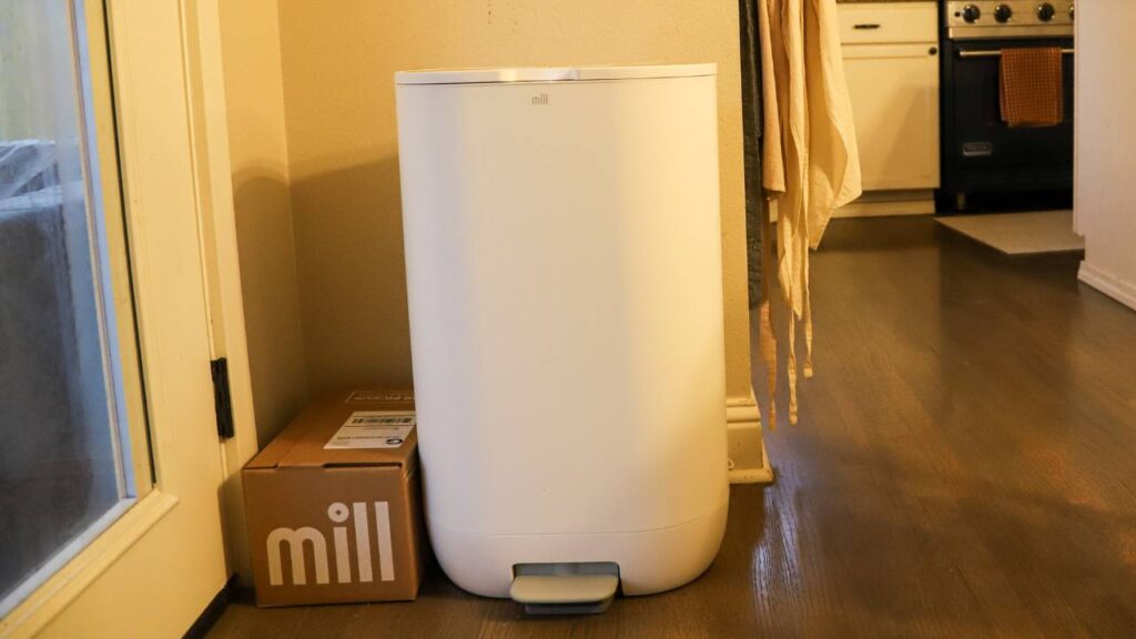 Mill food recycler standing next to its shipping box
