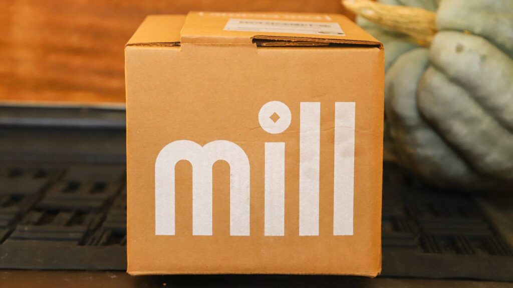 Cardboard Mill shipping box on a front porch.