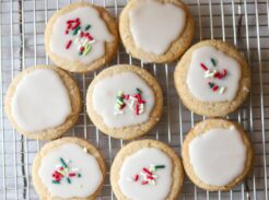Overhead view of iced whole grain sugar cookies on a cooling rack