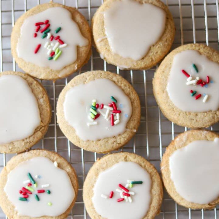 Overhead view of iced whole grain sugar cookies on a cooling rack