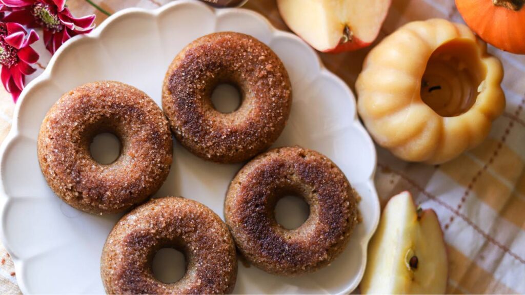 Whole grain apple cider donuts on a white plate