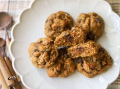 Overhead view of pumpkin coconut chocolate chip cookies on a white plate