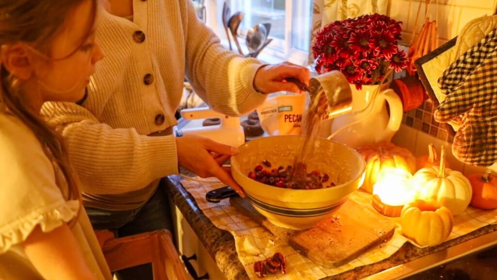 Mixing cranberry orange bread batter in a bowl