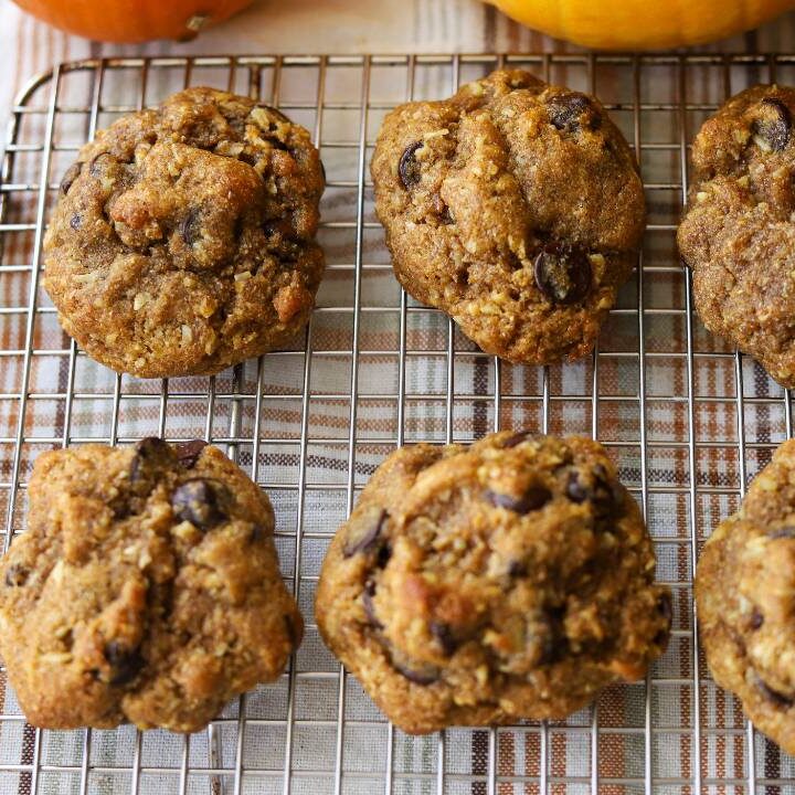 Pumpkin coconut chocolate chip cookies arranged on a cooling rack