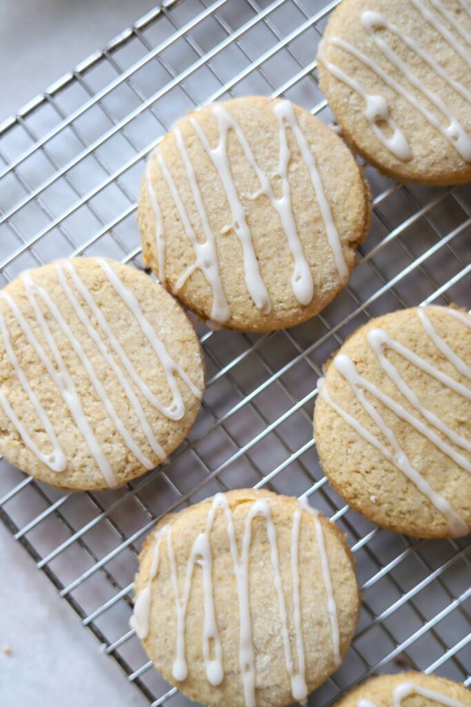 Freshly baked whole grain sugar cookies with icing drizzle