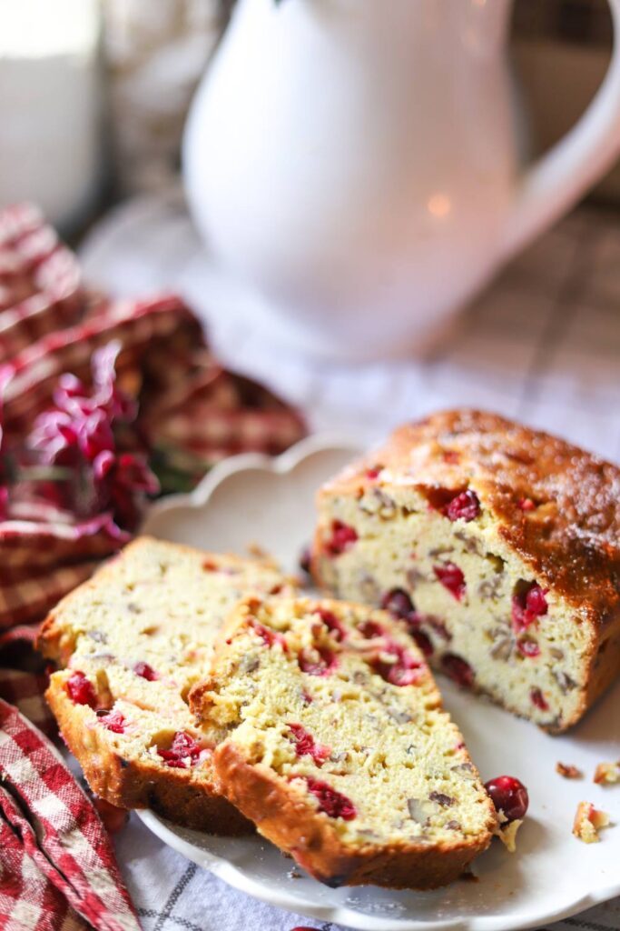 Cranberry orange bread slices on a cozy kitchen table