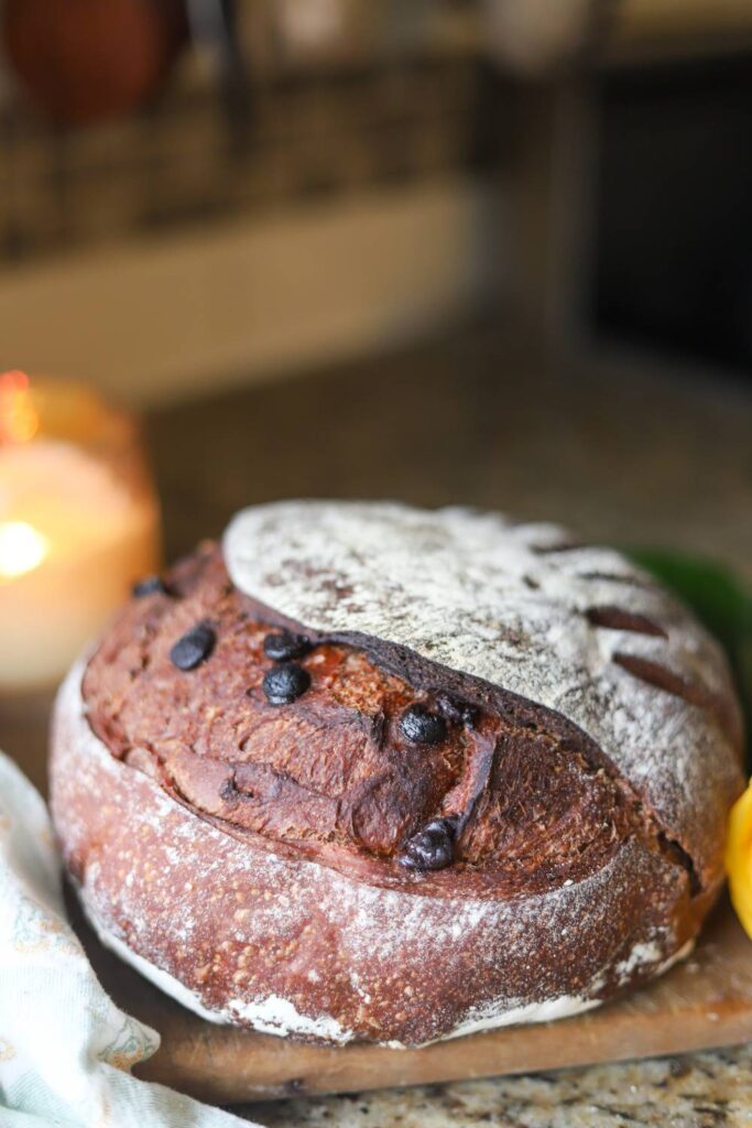 Sourdough chocolate bread loaf on cutting board