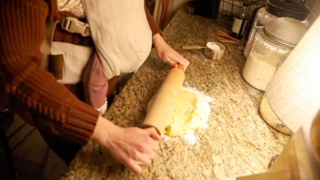 Rolling out einkorn sugar cookie dough on a floured counter