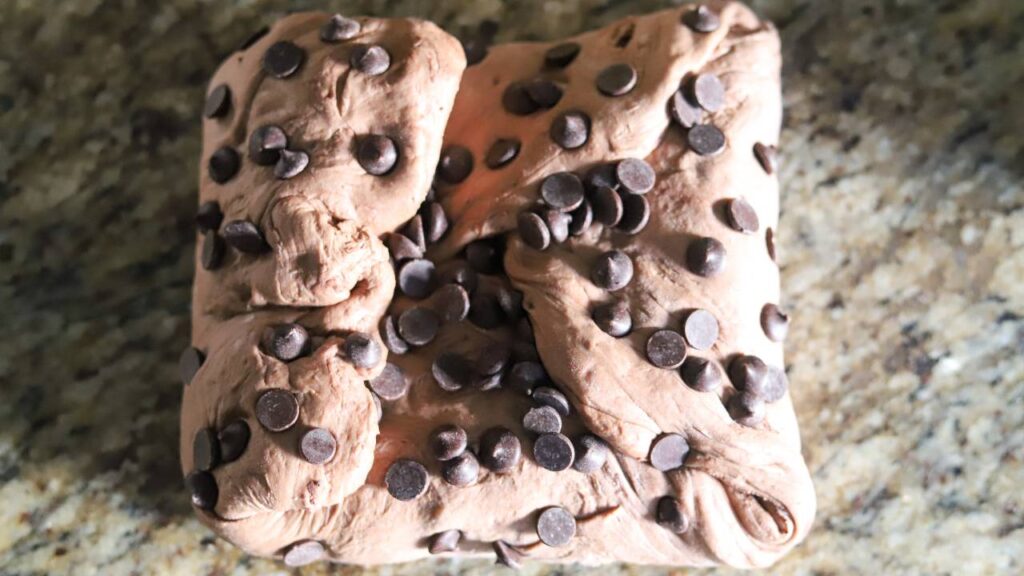 Chocolate chips folded into sourdough dough