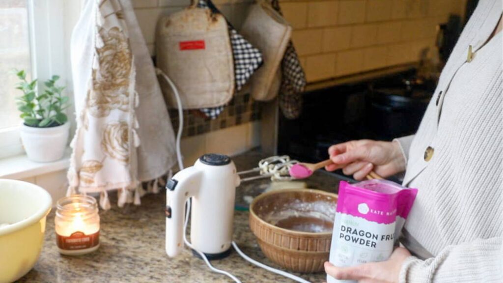 Mixing icing for einkorn lemon sugar cookies in a home kitchen