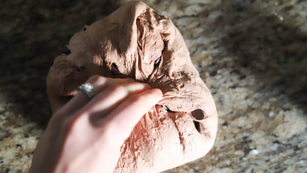 Stretching chocolate sourdough dough with chips