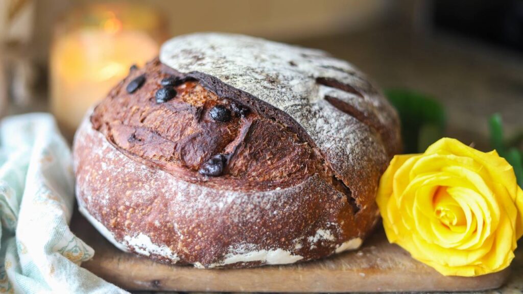 Sourdough chocolate bread loaf with yellow rose