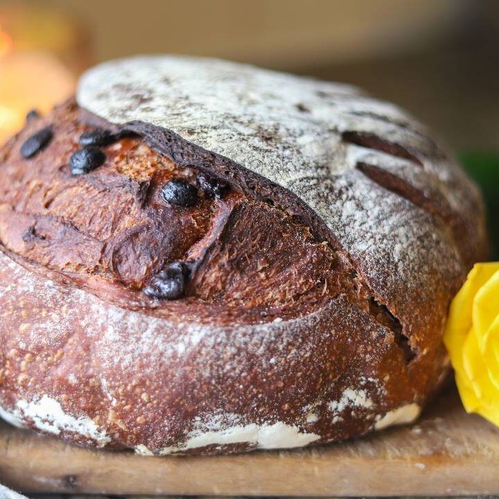 Sourdough chocolate bread loaf with yellow rose