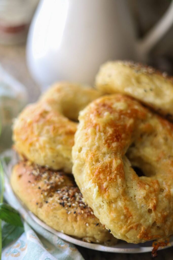 Close-up of homemade einkorn sourdough bagels with melted cheese topping