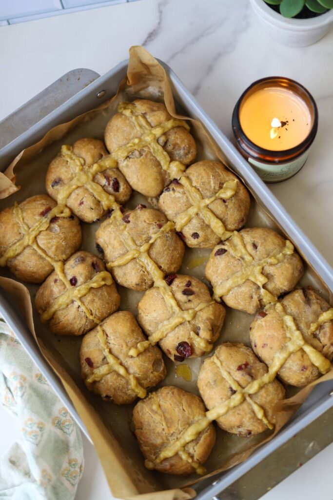 Baked sourdough einkorn hot cross buns in a baking pan
