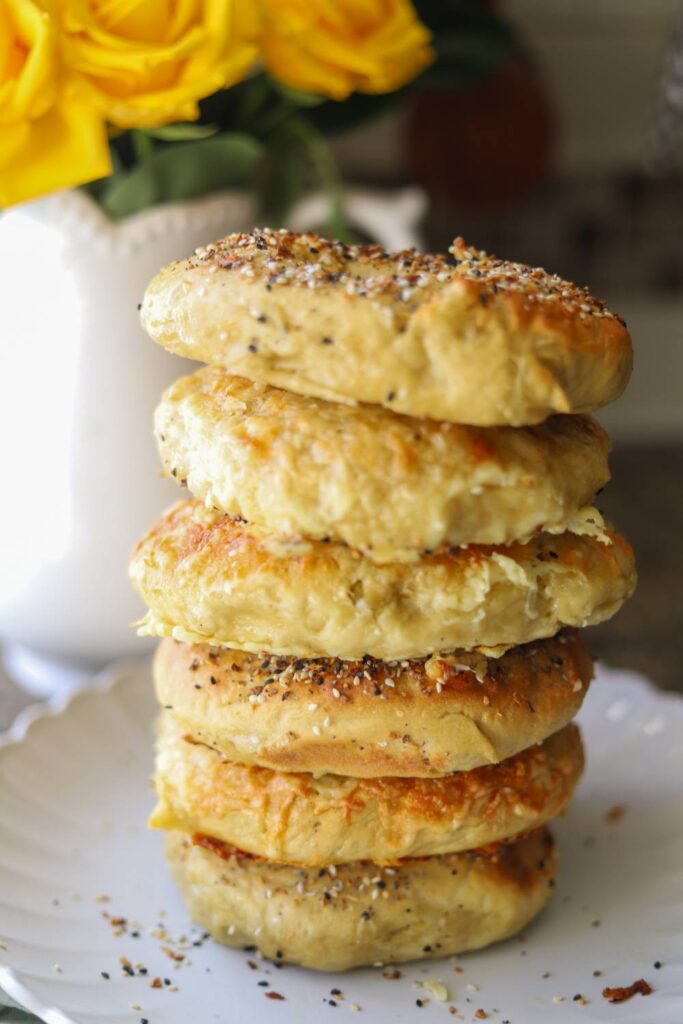 Tall stack of homemade einkorn sourdough bagels with everything seasoning