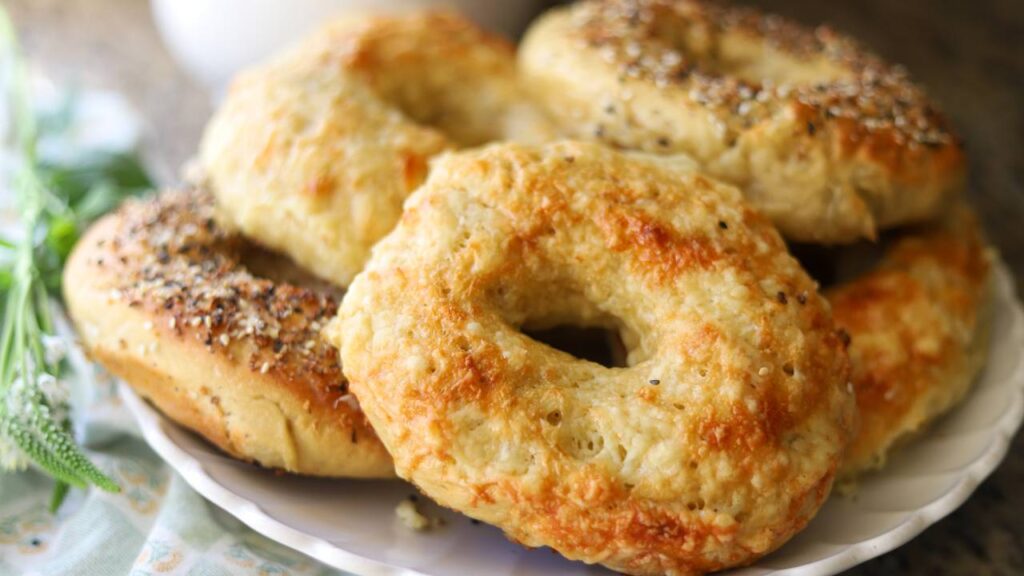 Fresh baked einkorn sourdough bagels topped with melted cheese