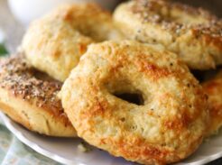 Fresh baked einkorn sourdough bagels topped with melted cheese