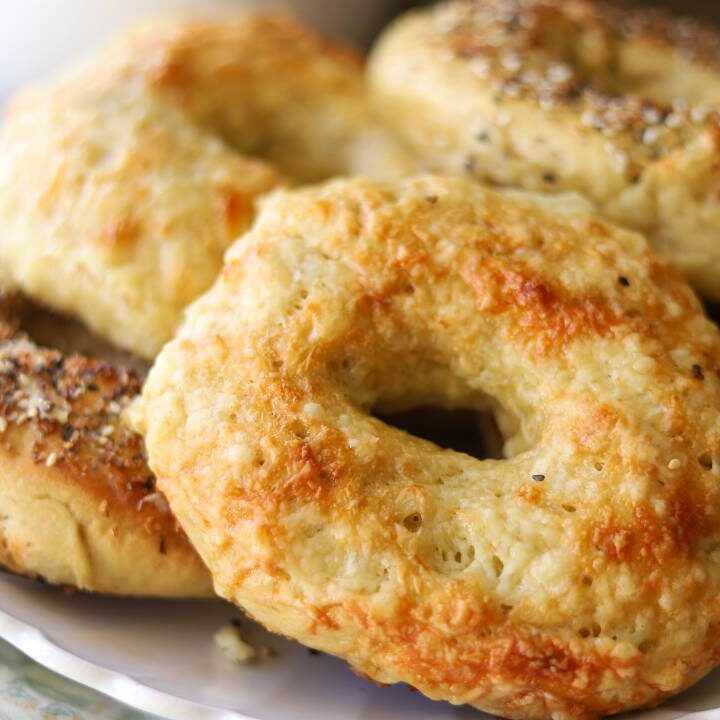 Fresh baked einkorn sourdough bagels topped with melted cheese
