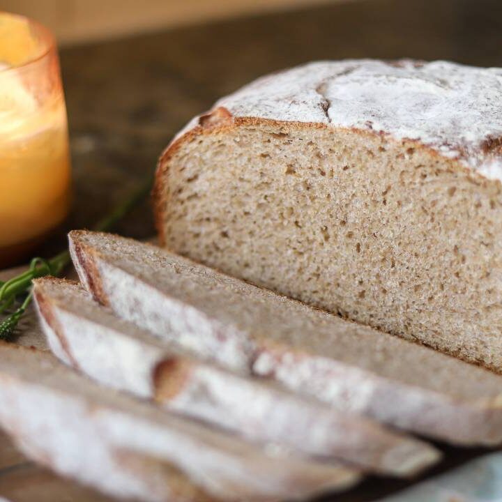 Sliced whole grain sourdough buttermilk bread showing soft crumb