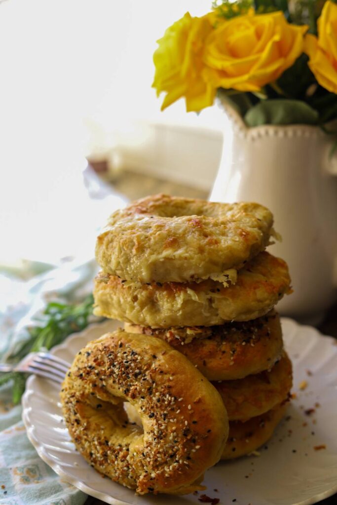 Stack of homemade einkorn sourdough bagels topped with everything seasoning