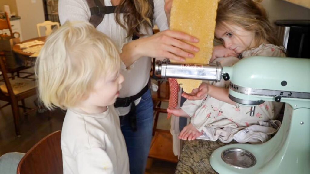 Kids helping make homemade whole grain pasta with pasta attachment mixer