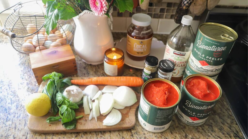 Ingredients for homemade tomato basil pasta sauce on kitchen counter