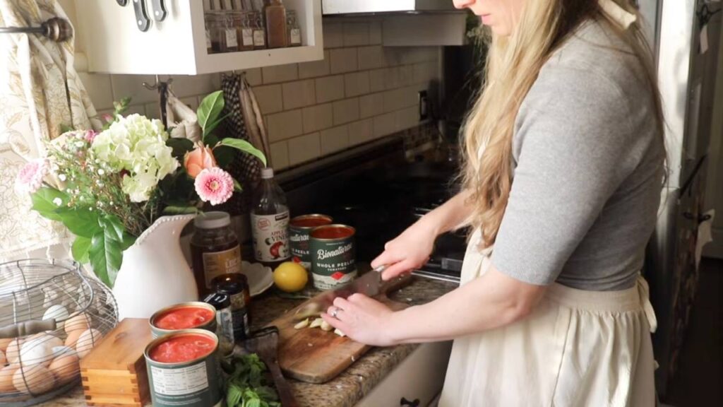 Chopping vegetables for rustic tomato basil pasta sauce recipe