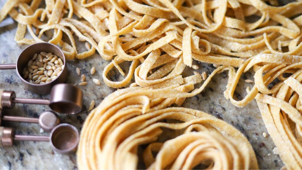 Close up of fresh whole wheat pasta nests and noodles