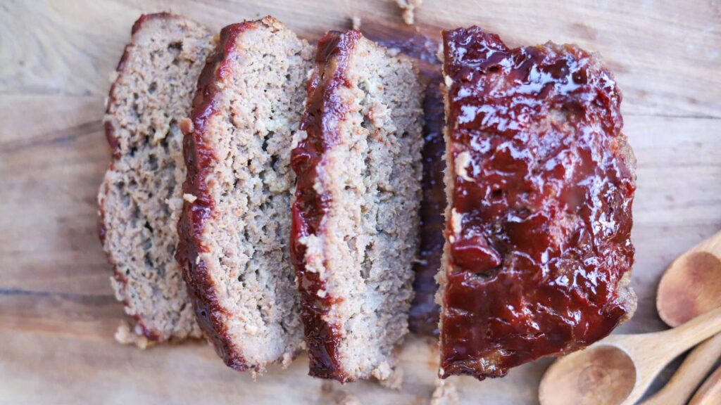 Top view of sliced meatloaf with ketchup glaze