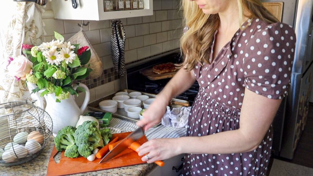 Chopping carrots and broccoli for homemade broccoli cheddar soup