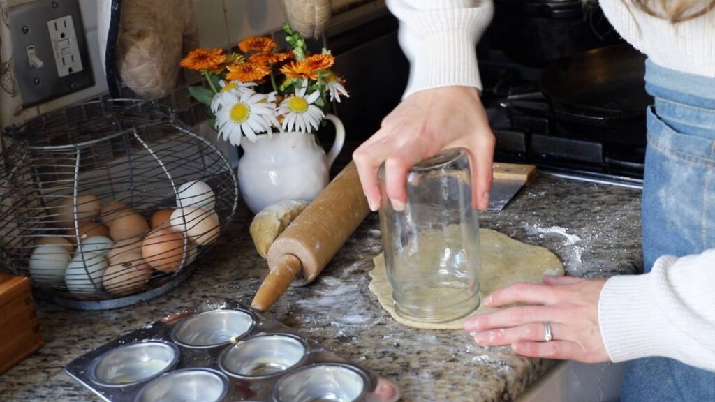 Cutting homemade pie crust circles with a glass jar