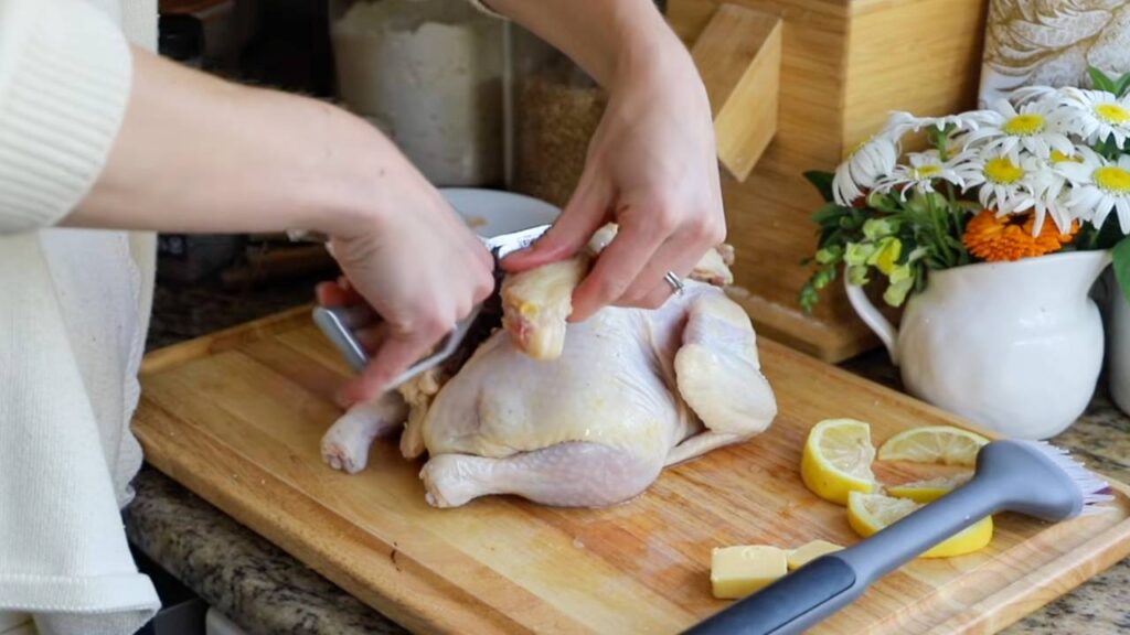 Removing the backbone from a whole chicken for spatchcocking.