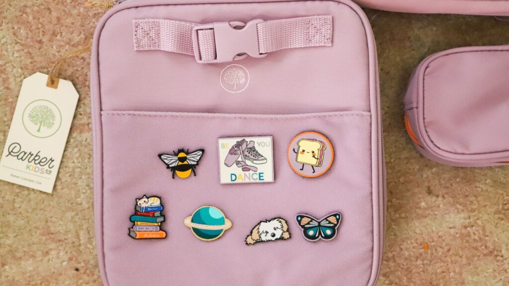 purple Parker Kids lunchbox decorated with colorful patches