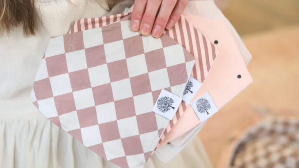 Parker Baby Co cotton baby bibs in pink and brown patterns