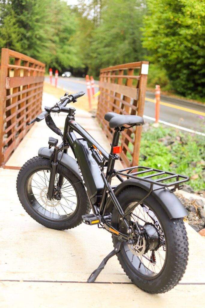 Qlife fat tire electric bike on a wooden bridge trail