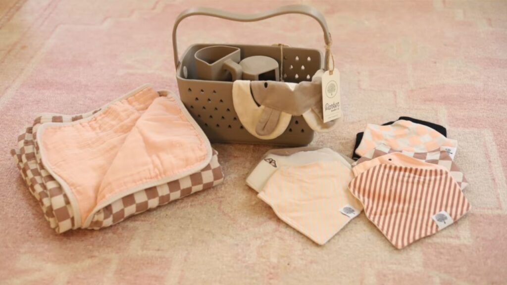 Parker Baby Co baby products including quilt, bibs, and bath caddy