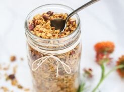 Jar of pumpkin spice granola with a spoon