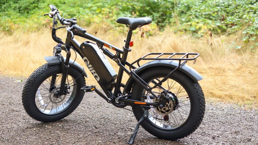 Qlife Racer fat tire electric bike parked on a gravel trail