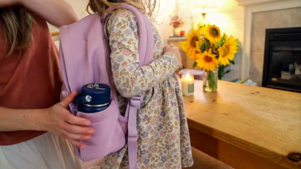 Child wearing a purple Parker Kids backpack